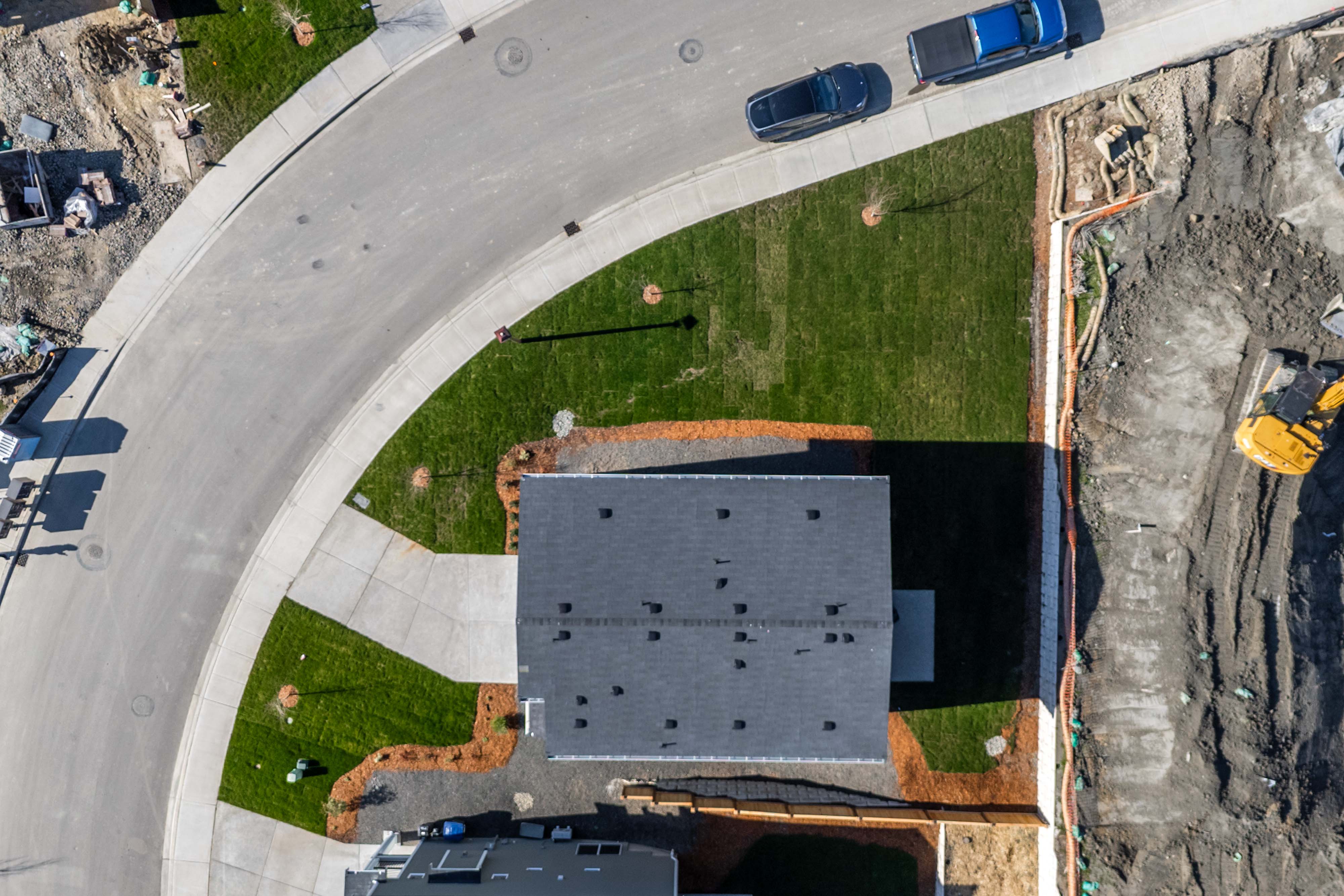 A building with a grass field.