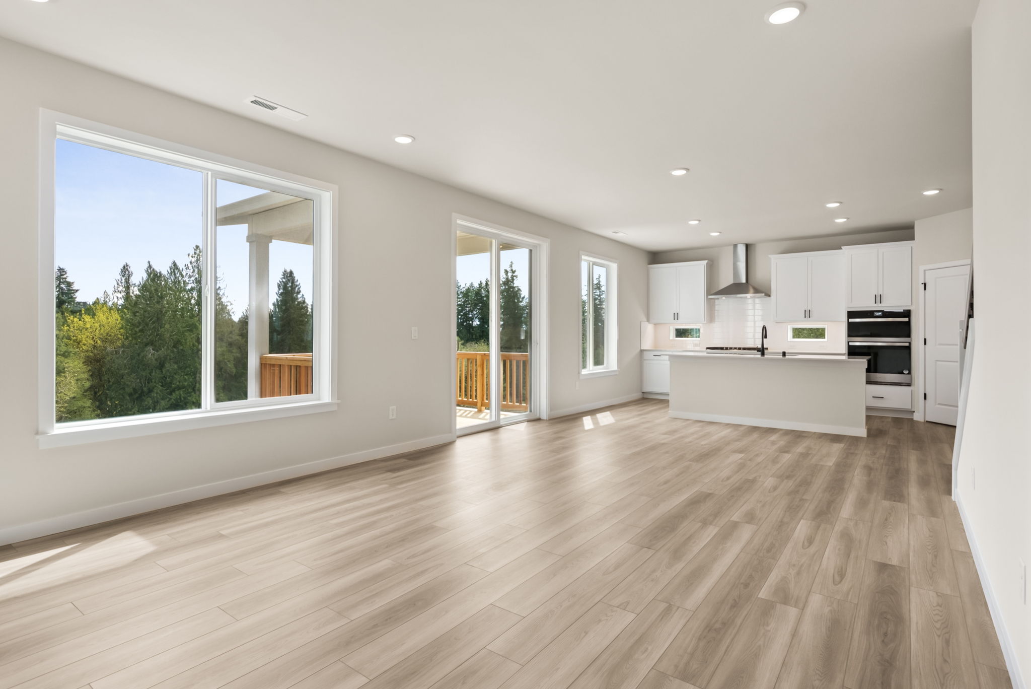 A large kitchen with white cabinets.