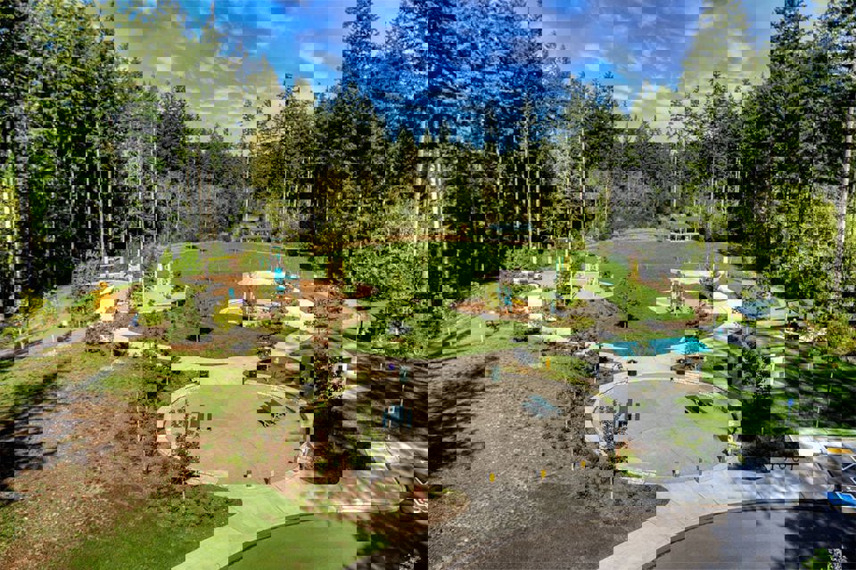 A park with trees and a swimming pool.