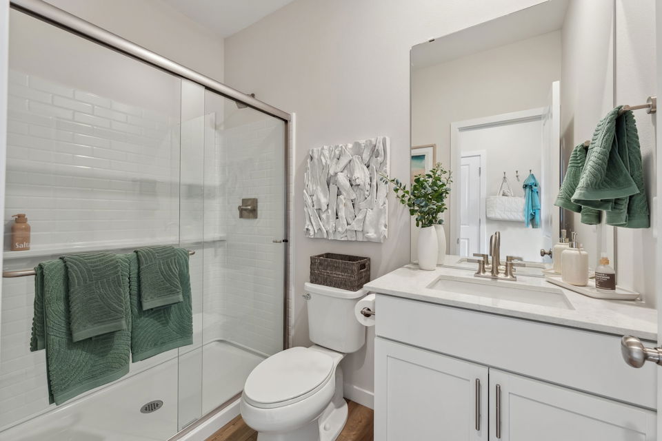 A bathroom with a glass shower.