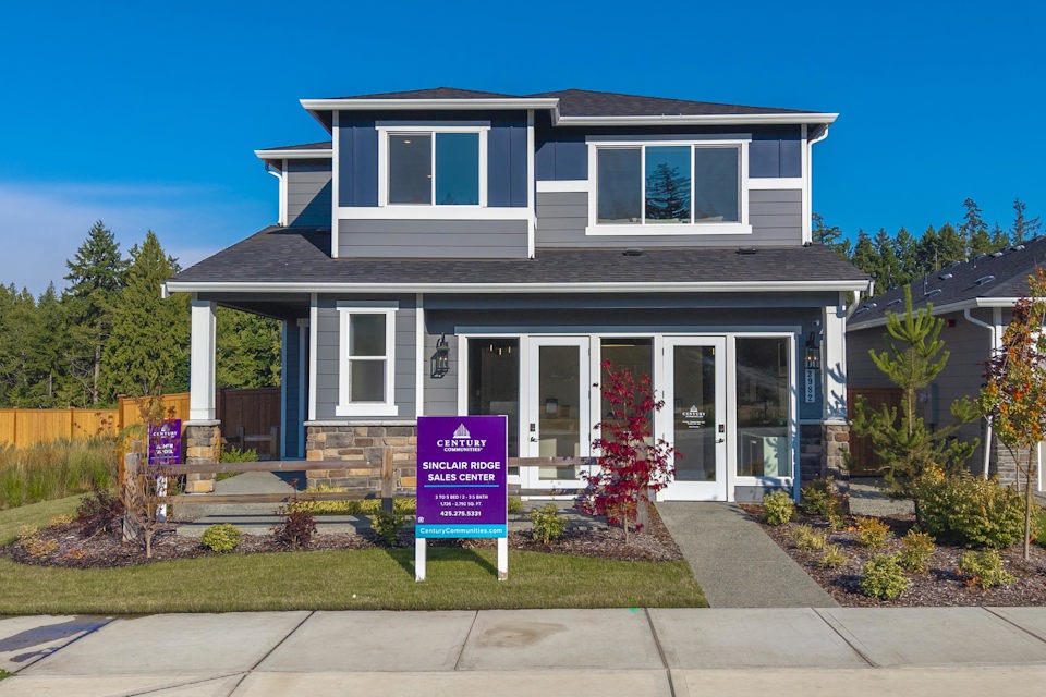 A house with a sign in front.
