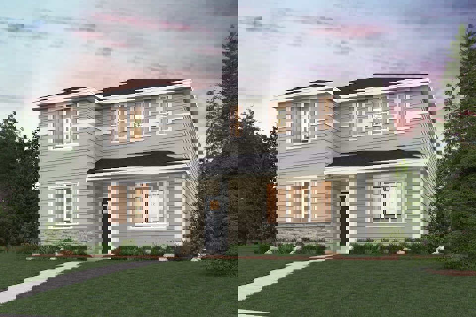 A house with a lawn in front of it.