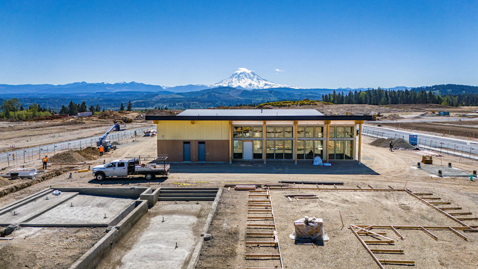 A building with a mountain in the background.