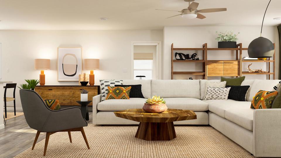 A living room with a couch and a table.