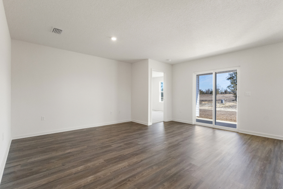 A room with a wood floor and a wood floor.