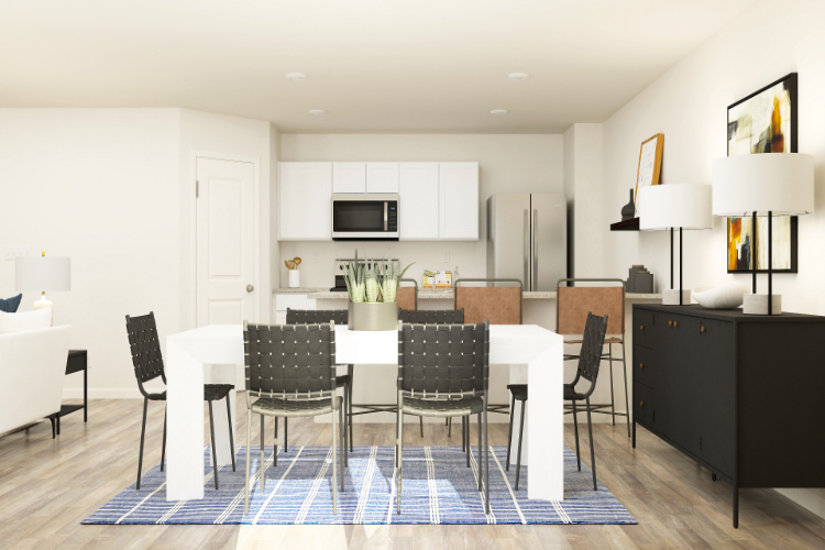 A kitchen with a dining table and chairs.