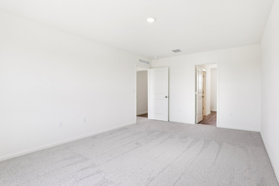 A hallway with white walls.
