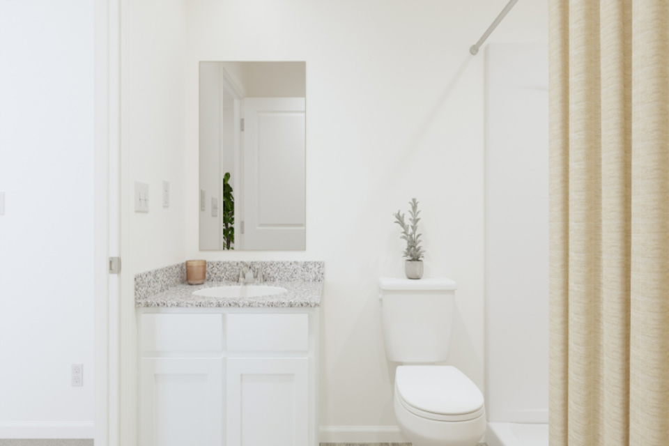 A bathroom with a toilet and sink.