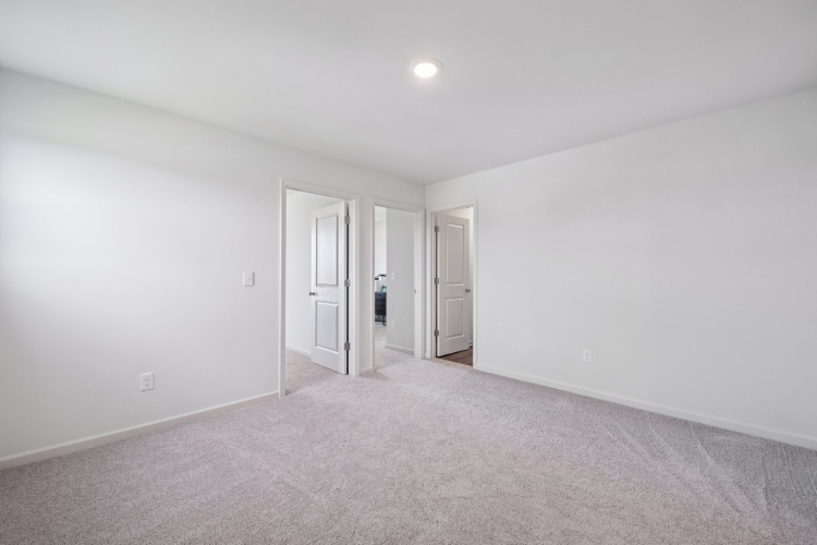 A hallway with white walls.