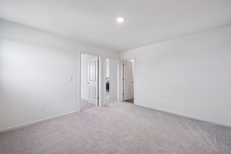 A hallway with white walls.