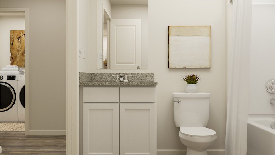 A bathroom with a toilet and sink.