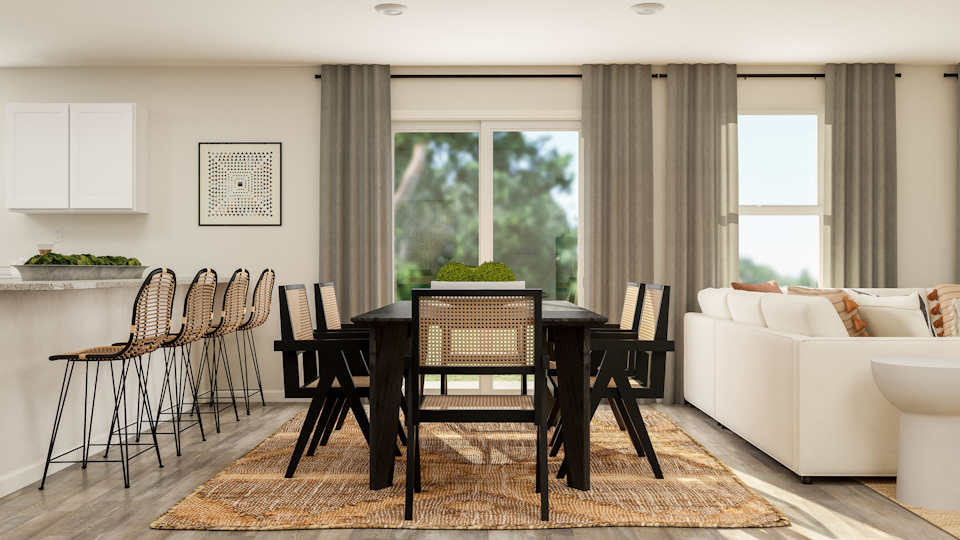 A living room with a table and chairs.