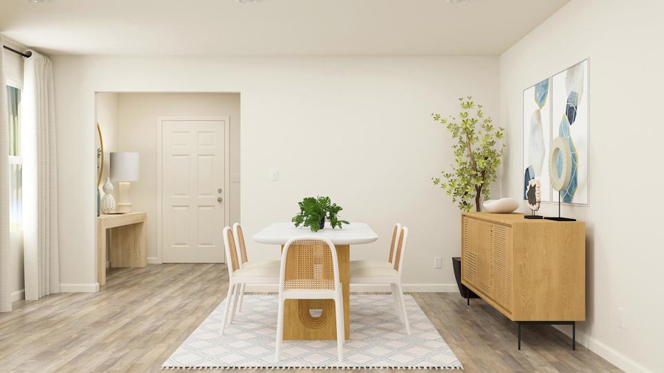 A room with a table and chairs.