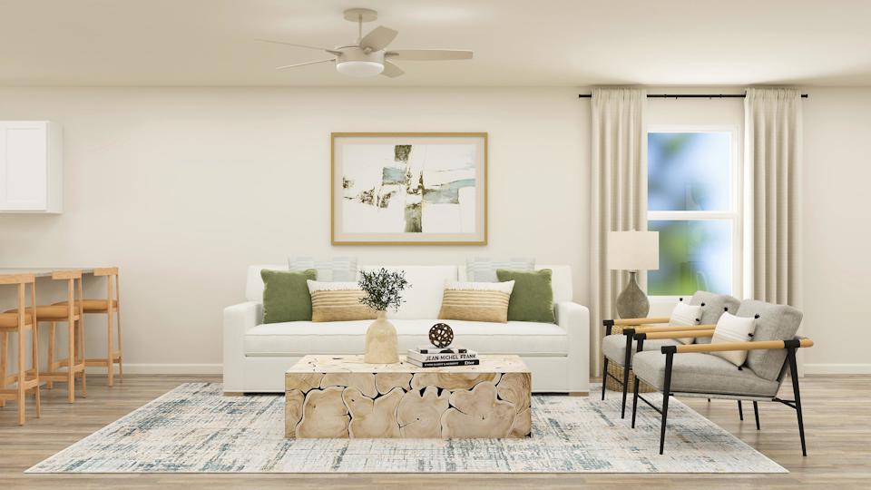 A living room with a couch and a table.