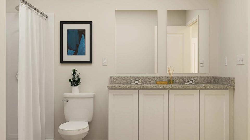 A bathroom with a marble countertop.