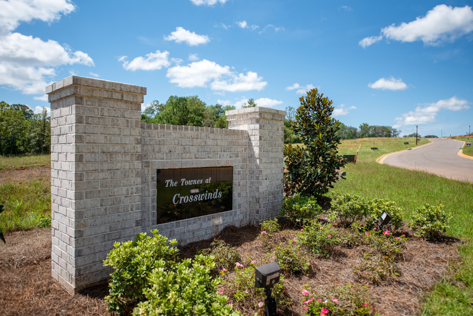 A stone wall with a sign on it.