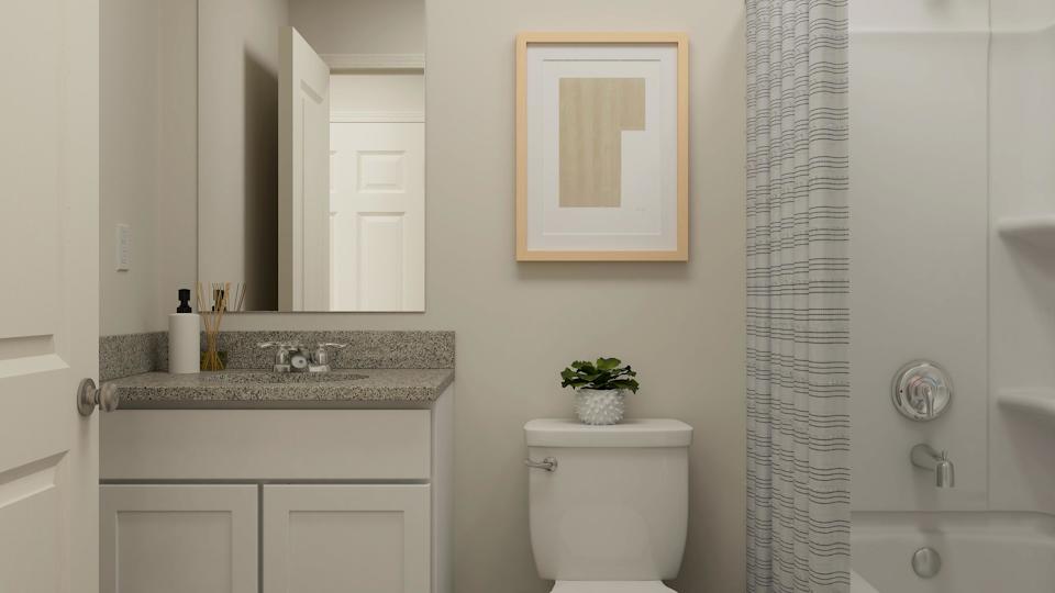 A bathroom with a sink and toilet.