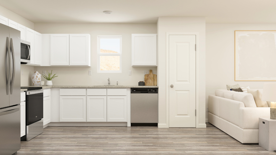 A kitchen with white cabinets.