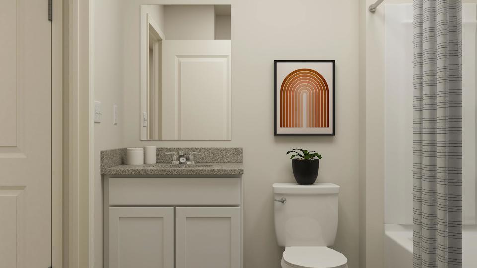 A bathroom with a toilet and a sink.