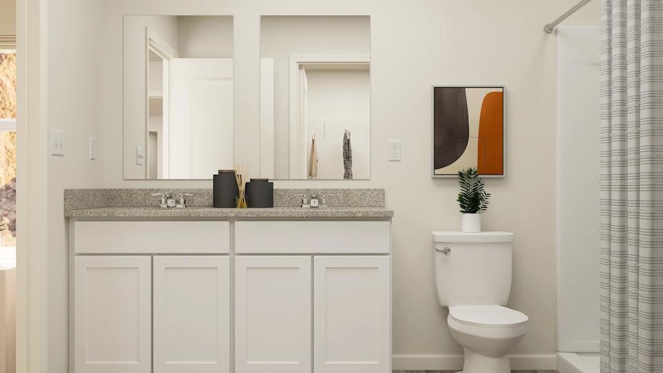A bathroom with a toilet and sink.
