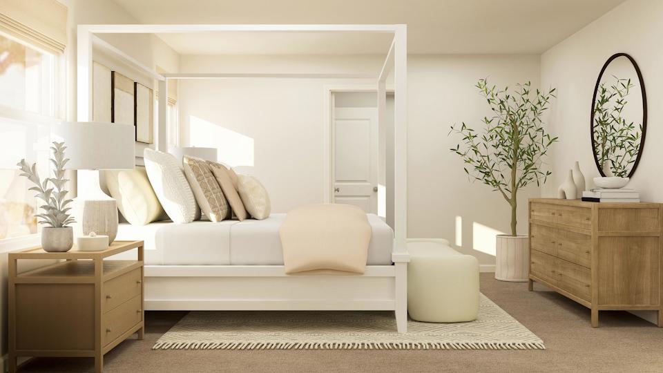 A living room with a white couch and a table.