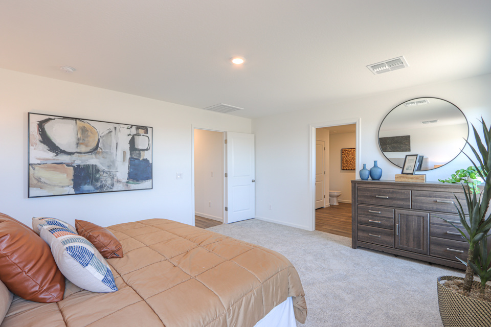 A living room with a large mirror.