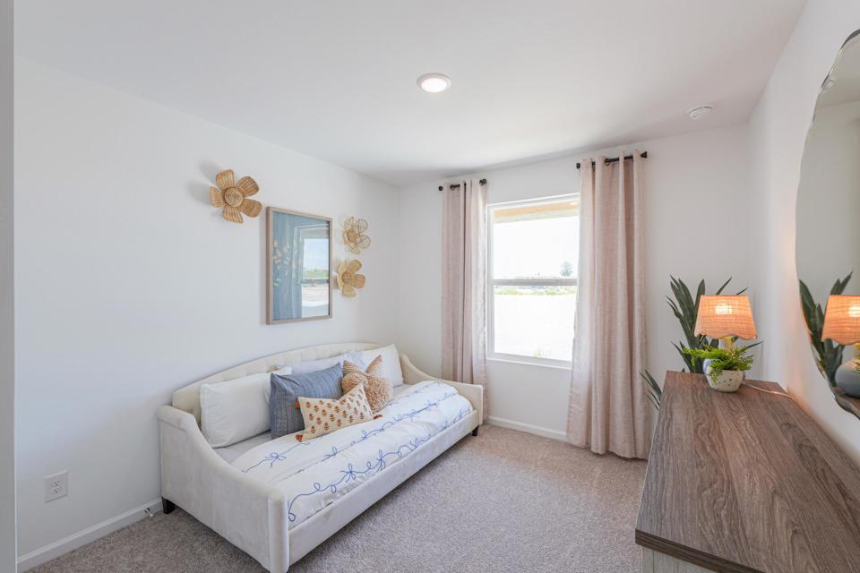 A living room with a white couch.