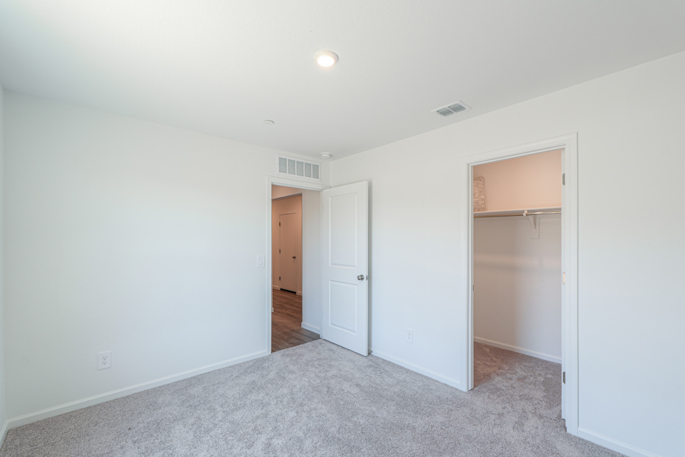 A hallway with white doors.