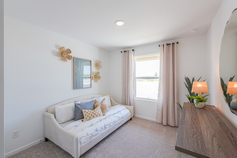 A living room with a white couch.