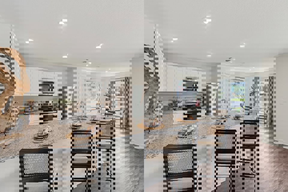 A kitchen with a marble island.