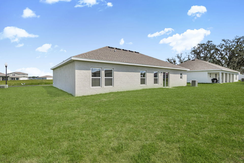 A house with a large lawn.