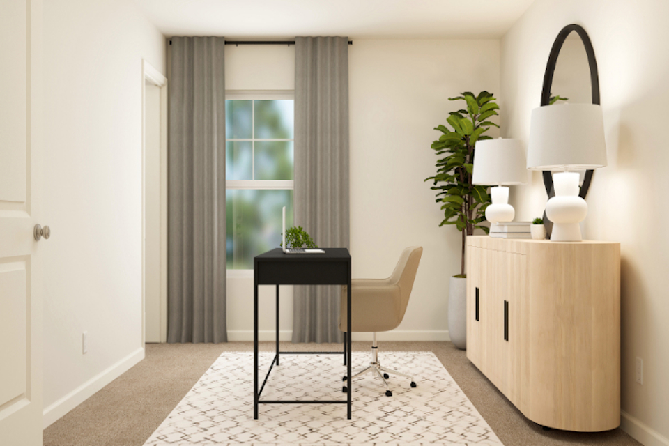 A room with a table and chairs.