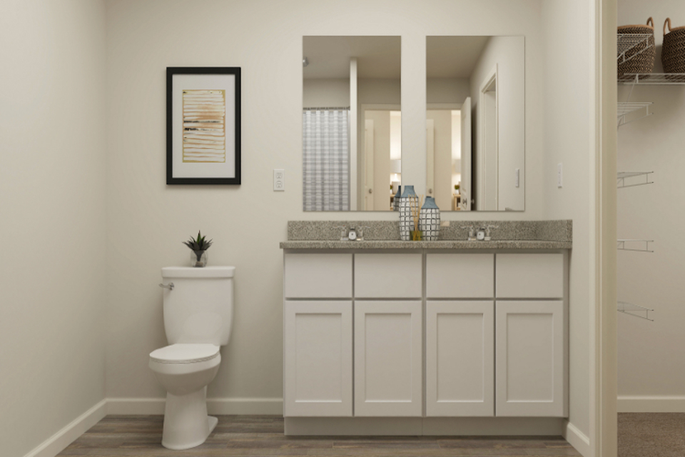 A bathroom with a toilet and sink.