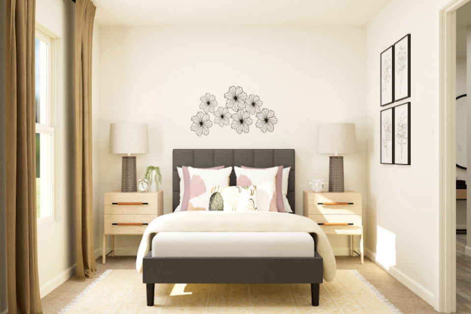 A bedroom with a bed and lamps.