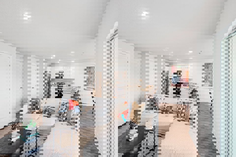 A living room with a couch and a table.