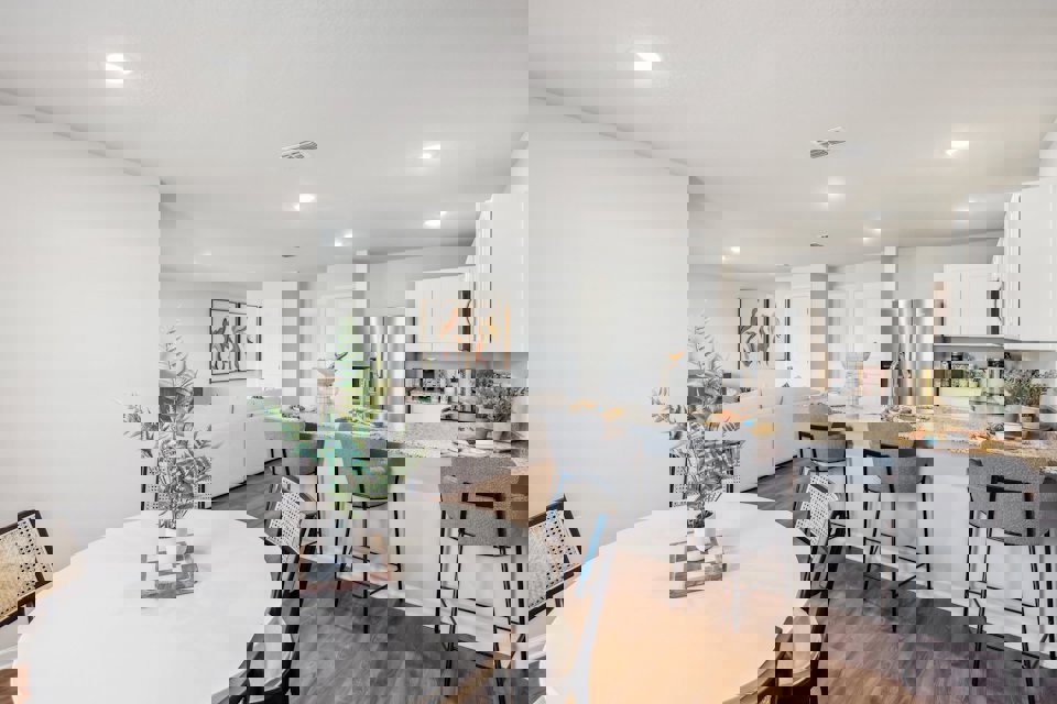 A kitchen with a dining table.