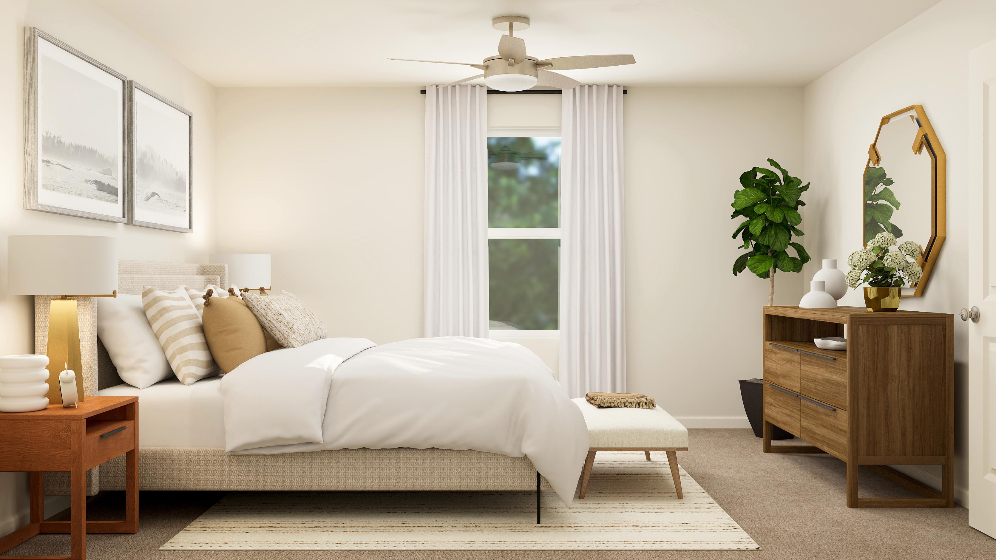 A bedroom with a bed and a table.