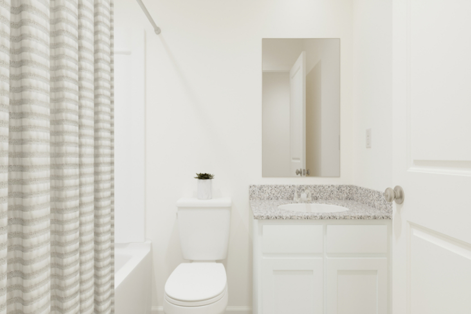 A bathroom with a sink and toilet.