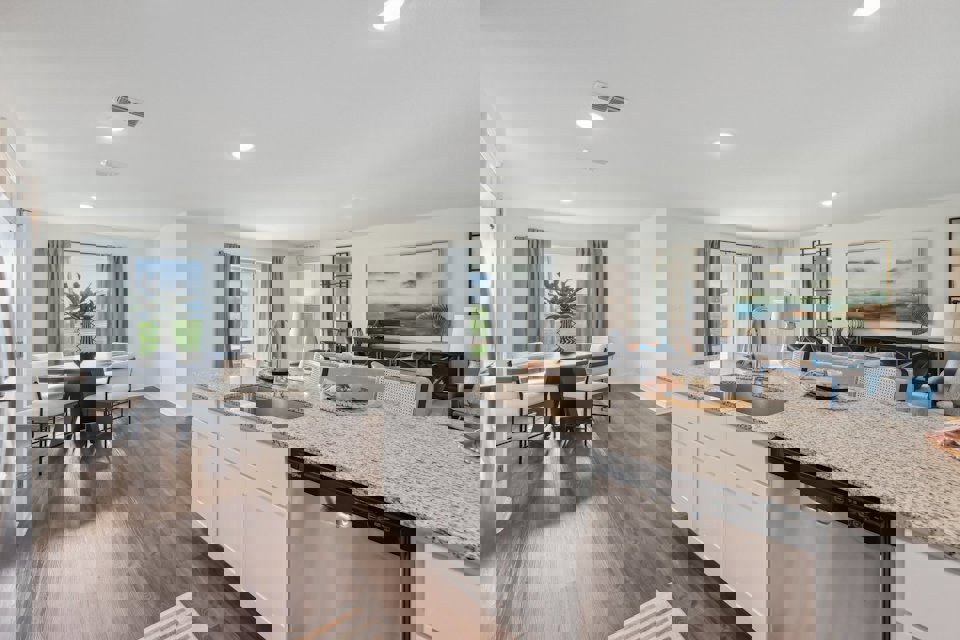 A kitchen with a marble island.