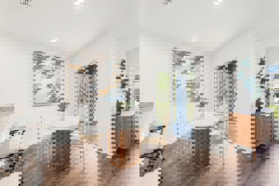 A room with a table and chairs.