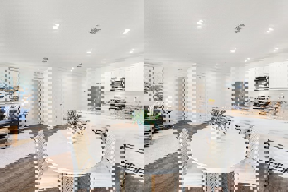 A kitchen with a dining table.