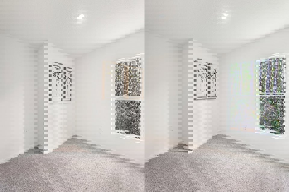 A room with a few paintings on the wall.