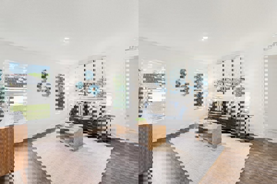 A living room with a couch and a coffee table.