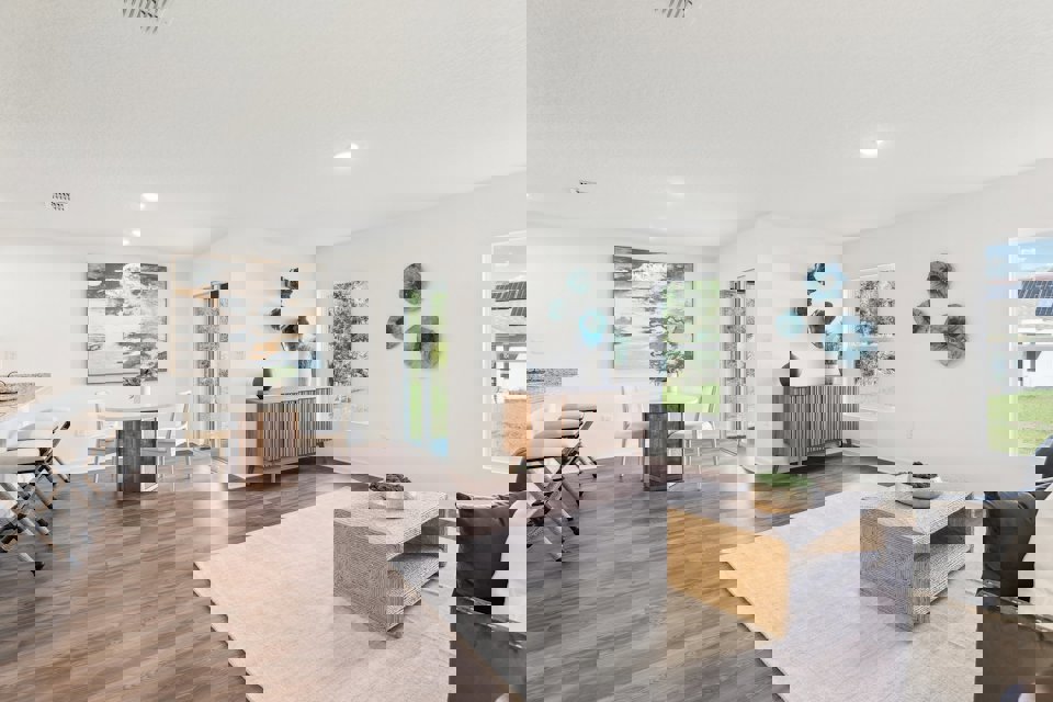 A large living room with a wood floor and a wood floor.