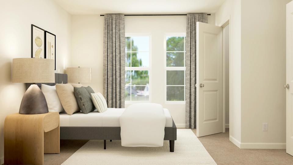 A living room with a couch and a chair.