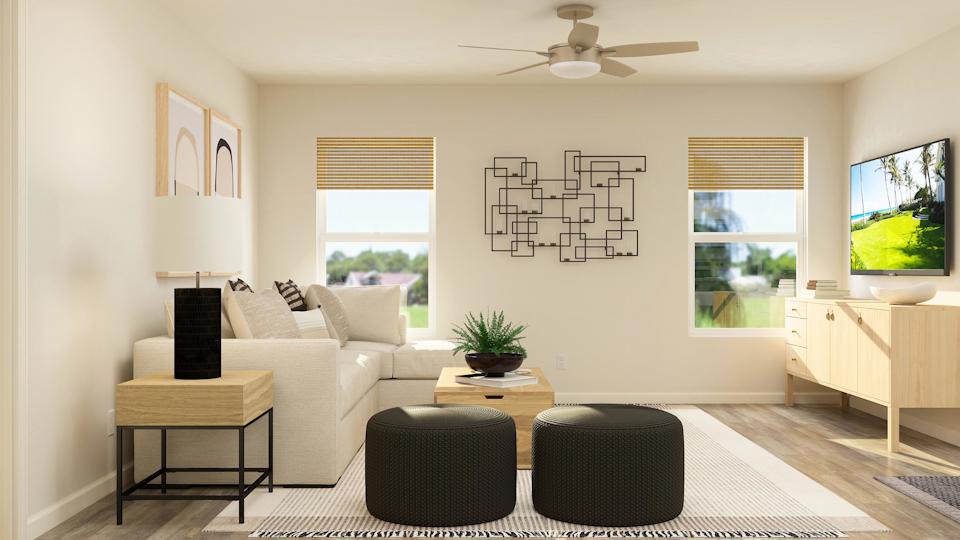 A living room with a couch and a table.