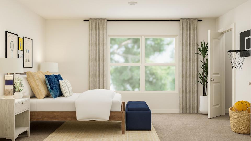 A living room with a couch and a table.