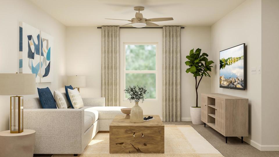 A living room with a couch and a table.