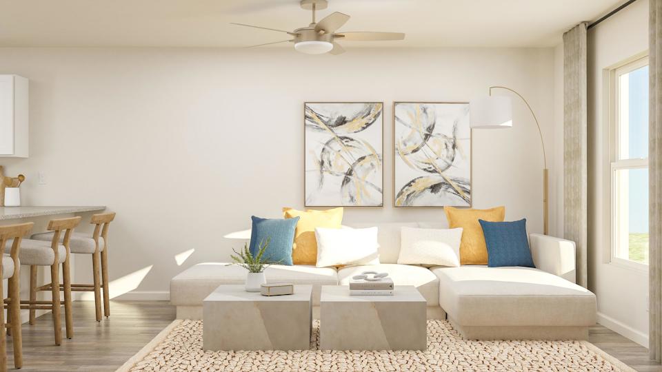 A living room with a couch and a table.