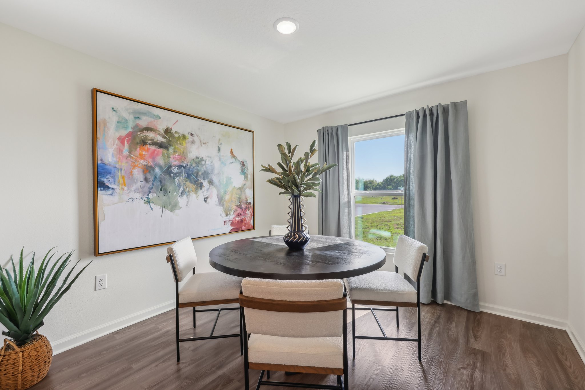 A dining room table with chairs.